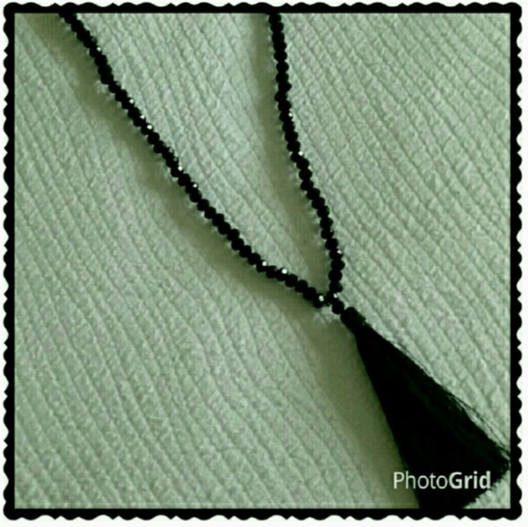 Boutique Chic Jewelry - Long black beaded necklace with tassel.